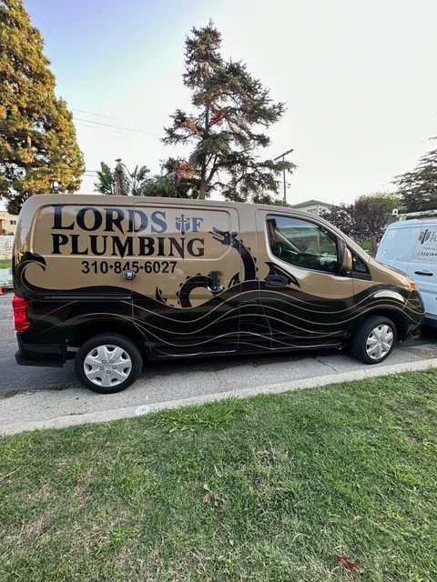 Lords of Plumbing service van parked at a job site