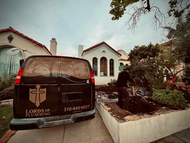 Lords of Plumbing van parked outside a customer's home