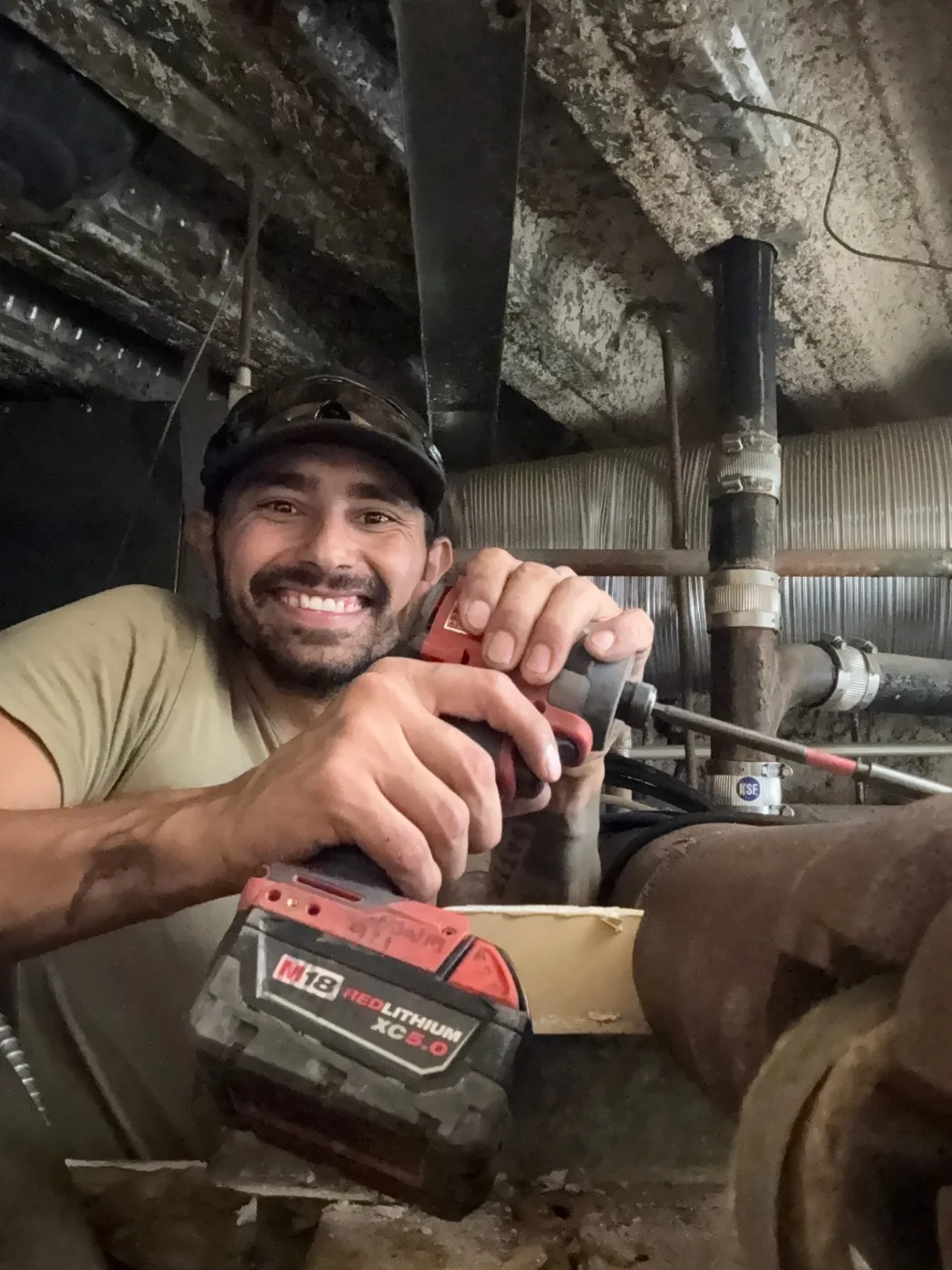 Lords of Plumbing technician with tools in a work van