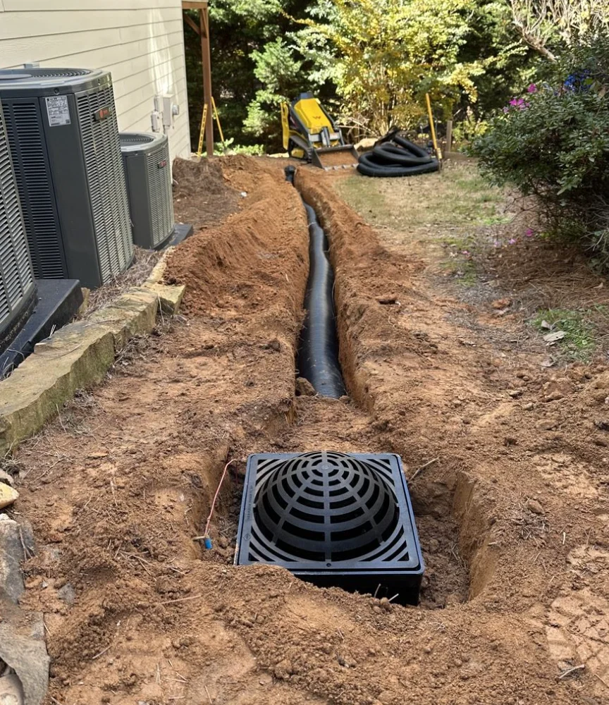 Open trench with new sewer pipe during a sewer line replacement