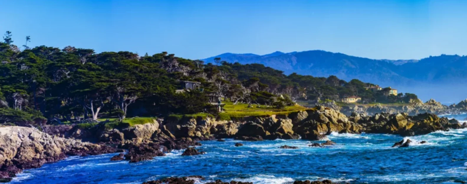 Rocky Monterey County coastline with cypress trees